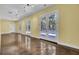Long basement with polished floors and multiple doors at 4429 Francis Younge Way, Hollywood, SC 29449