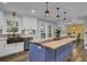 Modern kitchen with blue island, farmhouse sink, and wood countertops at 4429 Francis Younge Way, Hollywood, SC 29449