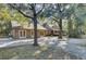 Rear view of house showcasing a large patio, and detached garage at 4429 Francis Younge Way, Hollywood, SC 29449