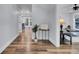 Hardwood floors and neutral walls create an inviting atmosphere in this hallway at 4429 Francis Younge Way, Hollywood, SC 29449