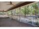Porch with wooden flooring, white railings, and a view of the backyard at 4429 Francis Younge Way, Hollywood, SC 29449