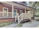 Front porch with a wooden staircase and railing at 4429 Francis Younge Way, Hollywood, SC 29449