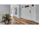 Bright entryway with hardwood floors, showcasing a view to the living area and deck at 4429 Francis Younge Way, Hollywood, SC 29449