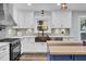 Modern kitchen with white cabinets, copper farm sink, and wood countertops at 4429 Francis Younge Way, Hollywood, SC 29449
