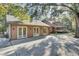 Detached garage with three large doors and a concrete patio at 4429 Francis Younge Way, Hollywood, SC 29449