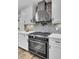 Modern kitchen with stainless steel appliances and decorative backsplash at 4429 Francis Younge Way, Hollywood, SC 29449