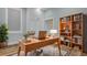 Bright home office featuring built-in shelving and hardwood floors at 4429 Francis Younge Way, Hollywood, SC 29449