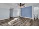 Bright bedroom with hardwood floors and a private bathroom at 4429 Francis Younge Way, Hollywood, SC 29449