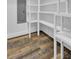 Walk-in pantry with ample shelving and hardwood floors at 4429 Francis Younge Way, Hollywood, SC 29449