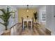 Charming dining room with white table, wicker chairs, and access to deck at 4429 Francis Younge Way, Hollywood, SC 29449