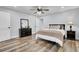 Bright bedroom with hardwood floors, ceiling fan, and ample closet space at 4429 Francis Younge Way, Hollywood, SC 29449