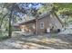 Brown house exterior with a detached barn, AC unit and propane tank at 4429 Francis Younge Way, Hollywood, SC 29449