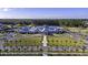 Aerial view of community clubhouse, pool, and tennis courts at 178 Garden Gate Way, Summerville, SC 29486