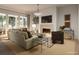 Living room with fireplace, comfortable seating, and large windows at 527 Helmsman St # 527, Daniel Island, SC 29492
