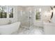 Elegant bathroom with marble floors, walk-in shower, and double vanity at 3904 Delinger Dr, Mount Pleasant, SC 29466