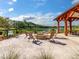 Fire pit area with seating overlooking lake at 3904 Delinger Dr, Mount Pleasant, SC 29466