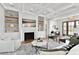 Living room with fireplace, built-ins, and access to screened porch at 3904 Delinger Dr, Mount Pleasant, SC 29466