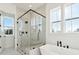 Modern bathroom featuring a frameless glass shower and a free-standing bathtub at 3904 Delinger Dr, Mount Pleasant, SC 29466