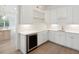 Butler's pantry with white shaker cabinets, quartz countertops, and wine cooler at 3904 Delinger Dr, Mount Pleasant, SC 29466
