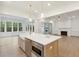 Island kitchen with quartz countertops, stainless steel appliances, and white cabinetry at 3904 Delinger Dr, Mount Pleasant, SC 29466