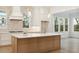 Gourmet kitchen boasting white cabinets, a large island, and a stylish backsplash at 3904 Delinger Dr, Mount Pleasant, SC 29466