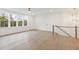 Bonus room with hardwood floors, multiple windows, and staircase at 3904 Delinger Dr, Mount Pleasant, SC 29466