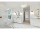 Spa-like bathroom with marble floors, frameless shower, and soaking tub at 3904 Delinger Dr, Mount Pleasant, SC 29466