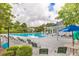 Community swimming pool with lounge chairs and a spa at 161 Golfview Ln, Summerville, SC 29485