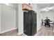 Kitchen features black refrigerator, dining area, and wood-look floors at 21 Rivers Point Row # 4B, Charleston, SC 29412