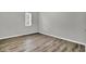Empty bedroom with wood-look floors and a window at 21 Rivers Point Row # 4B, Charleston, SC 29412