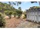 Landscaped front yard with white picket fence and manicured shrubs at 21 Rivers Point Row # 4B, Charleston, SC 29412
