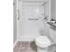 Bathroom with walk-in shower, toilet, and grab bars at 21 Rivers Point Row # 4B, Charleston, SC 29412