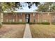 Brick apartment building with walkway and landscaping at 21 Rivers Point Row # 4B, Charleston, SC 29412