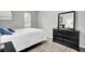 Bedroom with queen bed, dresser, and wood-look floors at 21 Rivers Point Row # 4B, Charleston, SC 29412