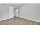 Empty bedroom with wood-look floors and neutral walls at 21 Rivers Point Row # 4B, Charleston, SC 29412