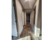 Long hallway with wood-look floors and access to bedrooms at 317 Marion Rd, Dorchester, SC 29437