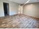 Spacious bedroom with wood-look vinyl flooring and ample closet space at 317 Marion Rd, Dorchester, SC 29437