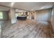 Open concept kitchen and dining area with modern island and wood-look floors at 317 Marion Rd, Dorchester, SC 29437