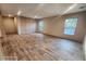 Bright and airy living area with wood-look floors and wall paneling at 317 Marion Rd, Dorchester, SC 29437