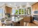 Kitchen boasts granite island and water views at 169 Marsh Island Dr, Kiawah Island, SC 29455