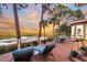 Spacious deck with lounge chairs overlooking tranquil marsh views at sunset at 169 Marsh Island Dr, Kiawah Island, SC 29455