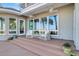 Deck with wicker chairs and a view of the marsh at 169 Marsh Island Dr, Kiawah Island, SC 29455
