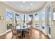 Breakfast room with water views and wood floors at 169 Marsh Island Dr, Kiawah Island, SC 29455
