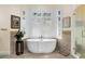 Relaxing bathroom with a free-standing bathtub and walk-in shower at 169 Marsh Island Dr, Kiawah Island, SC 29455