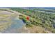Aerial view showing home on marshfront lot with private dock at 169 Marsh Island Dr, Kiawah Island, SC 29455