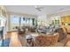 Living room with hardwood floors, fireplace and water views at 169 Marsh Island Dr, Kiawah Island, SC 29455