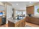 Bright kitchen with granite island and wine cooler at 169 Marsh Island Dr, Kiawah Island, SC 29455