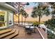 Deck with table and chairs overlooking a tranquil marsh sunset at 169 Marsh Island Dr, Kiawah Island, SC 29455