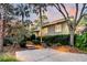 Exterior view of charming home with lush landscaping at 169 Marsh Island Dr, Kiawah Island, SC 29455