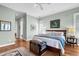 Spacious bedroom with wood floors, large windows, and neutral color palette at 169 Marsh Island Dr, Kiawah Island, SC 29455